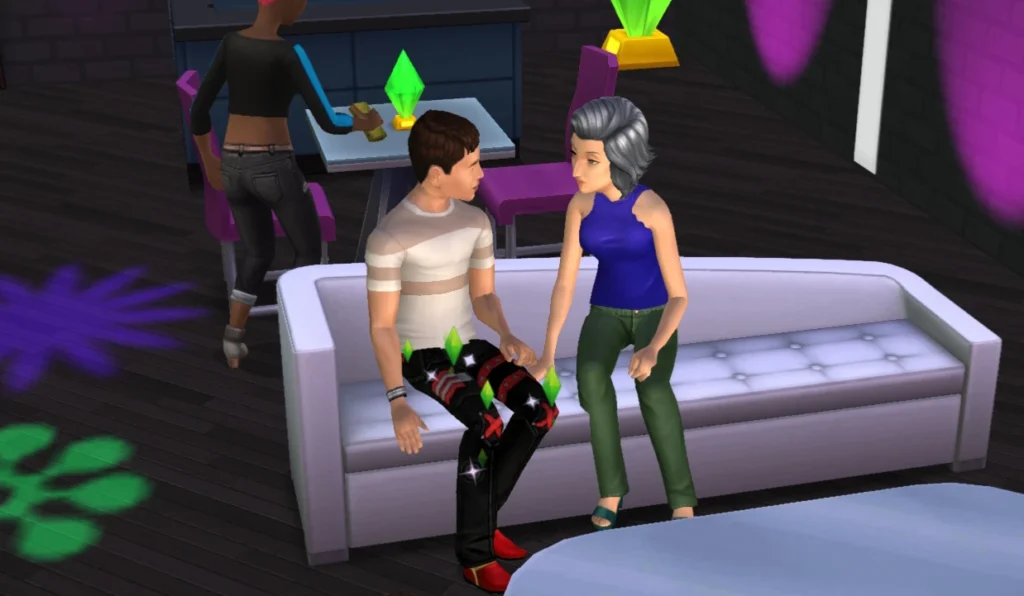 Dos Sims conversando en una casa de Los Sims Móvil